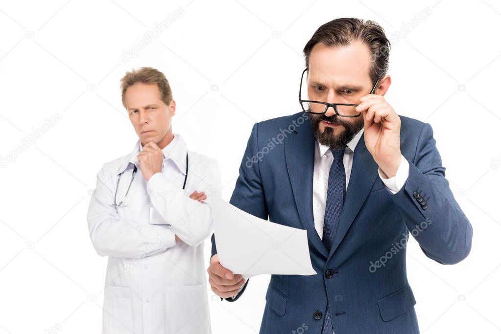 businessman holding medical document