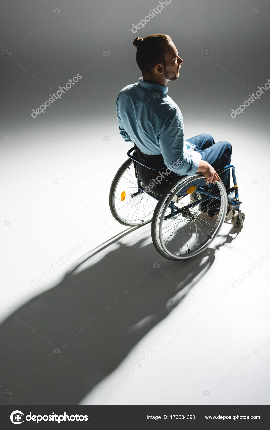 Young man in wheelchair — Stock Photo © NatashaFedorova 170684390