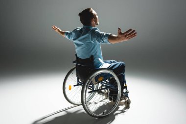 Disabled man posing with arms outstreched clipart
