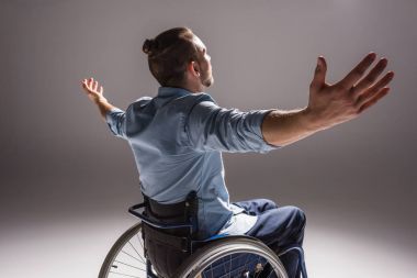 Disabled man with arms outstretched clipart
