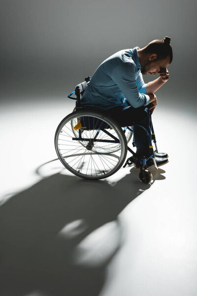 Despaired man in wheelchair 