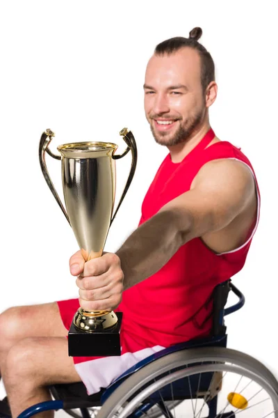 Sportsman in wheelchair with trophy — Free Stock Photo