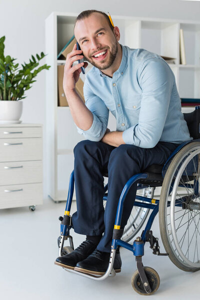 businessman in wheelchair on phone