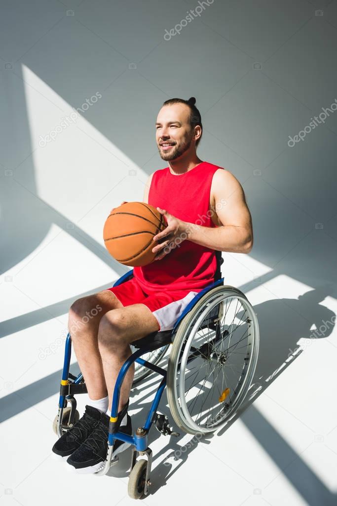 Hadicapped sportsman with basketball ball