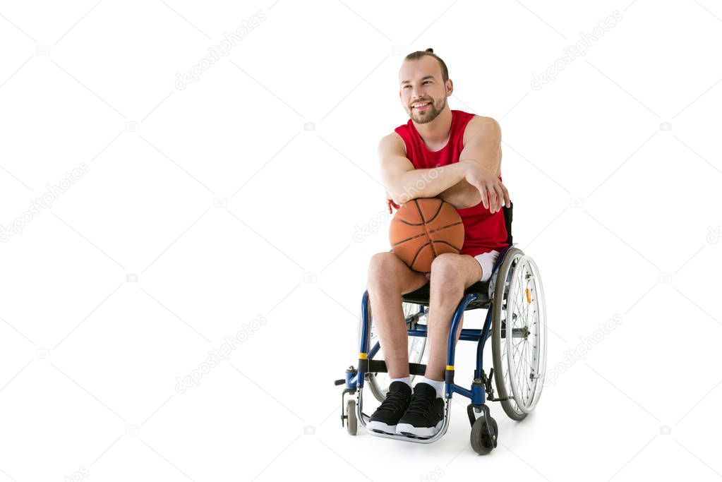 sportsman in wheelchair with basketball ball