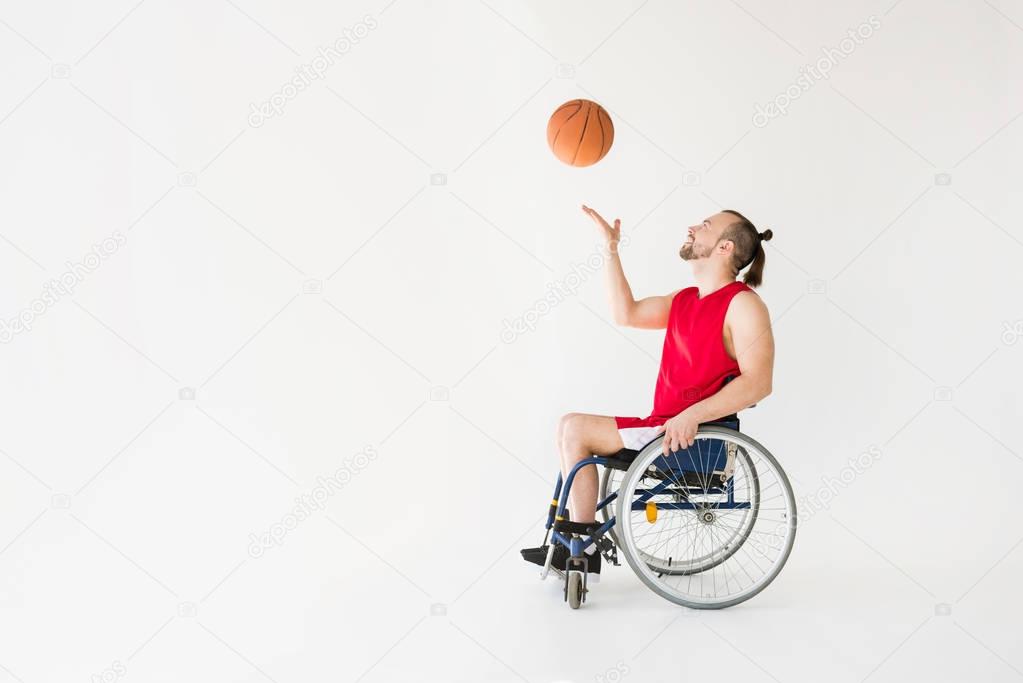 Disabled sportsman playing basketball