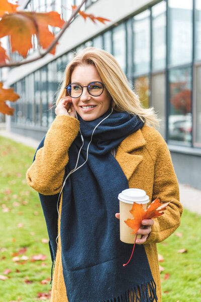 woman with coffee listening music