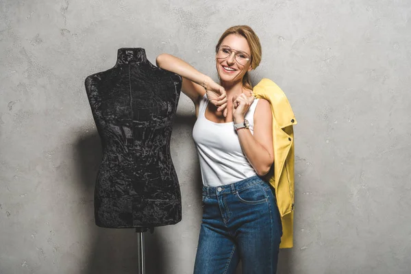 Mature seamstress with mannequin — Stock Photo, Image