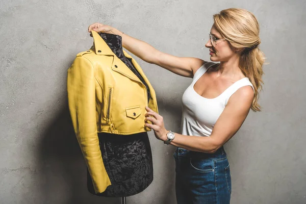 Dressmaker with yellow leather jacket — Stock Photo, Image