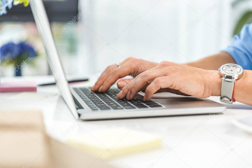 businesswoman typing in laptop