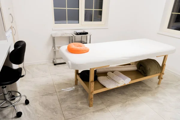 massage table with pillow in spa salon