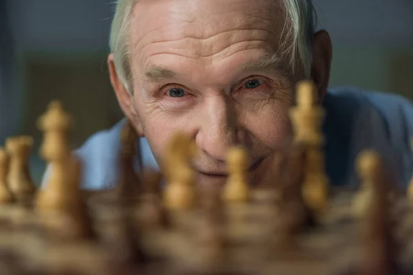 Senior Confident Man Looks Chess Board — Stock Photo, Image