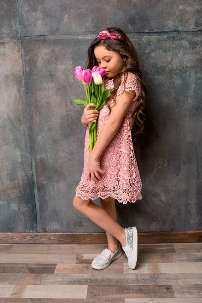 Little girl with flowers — Stock Photo