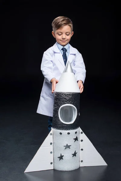 Little boy with rocket — Stock Photo