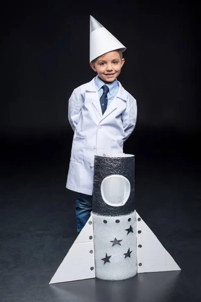 Little boy with rocket — Stock Photo