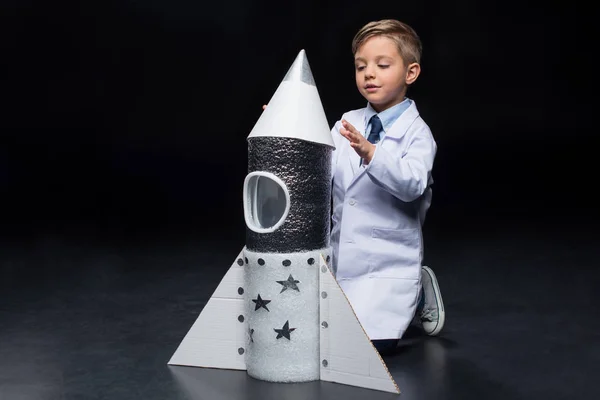 Little boy with rocket — Stock Photo