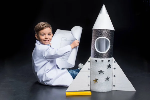 Little boy with rocket — Stock Photo