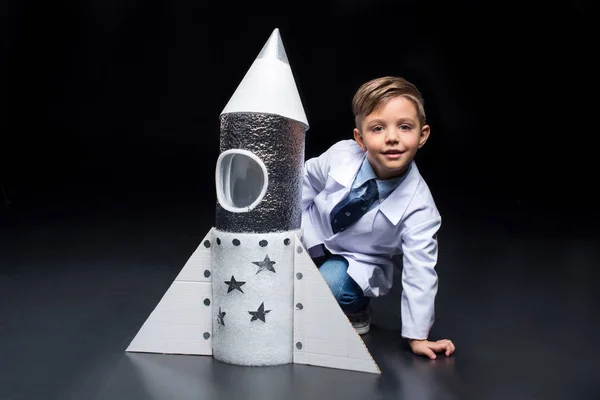 Little boy with rocket — Stock Photo