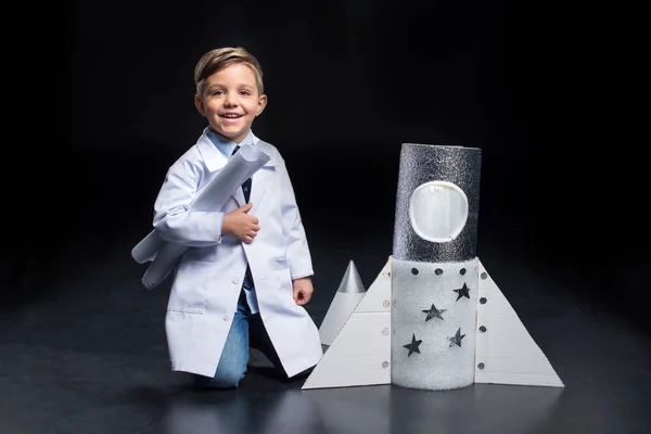 Little boy with rocket — Stock Photo