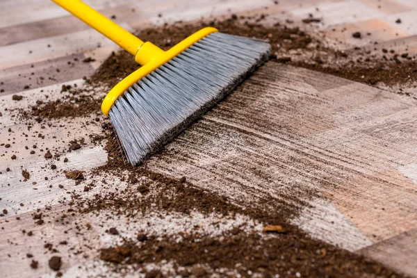 Broom sweeping floor — Stock Photo