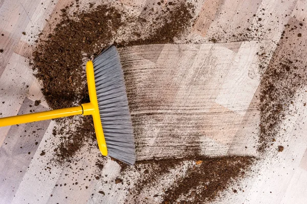 Broom sweeping floor — Stock Photo