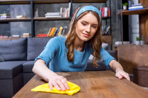 Woman cleaning table — Stock Photo