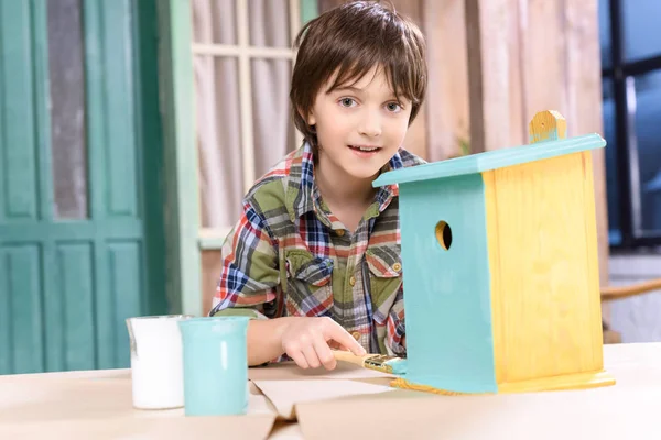 Boy making birdhouse — Stock Photo