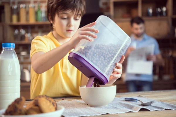 Boy with chocolate balls — Stock Photo