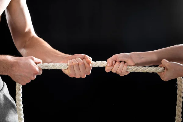 Man and woman pulling rope — Stock Photo