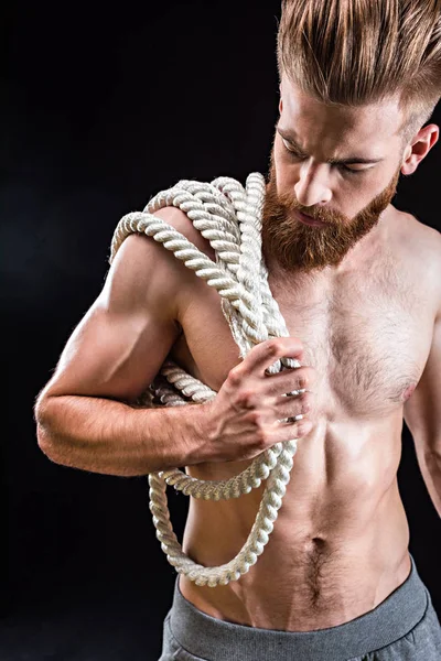Sportsman holding rope — Stock Photo