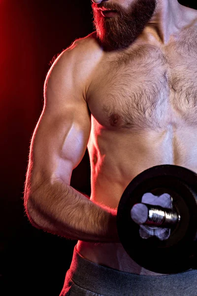 Bodybuilder training with dumbbell — Stock Photo