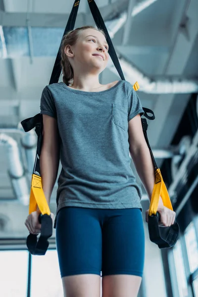 Girl training with resistance bands — Stock Photo