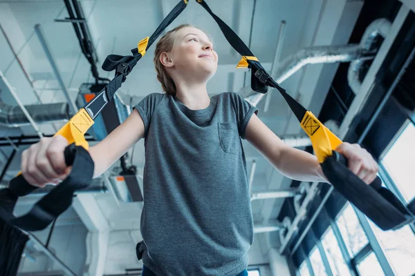 Girl training with resistance bands — Stock Photo