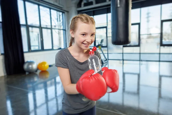 Preteen girl with sport bottle — Stock Photo