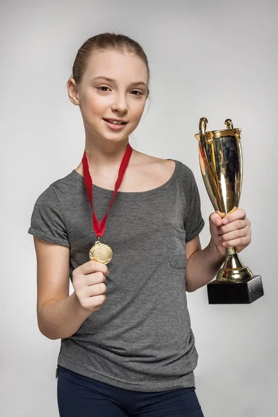 Girl with trophy and medal — Stock Photo