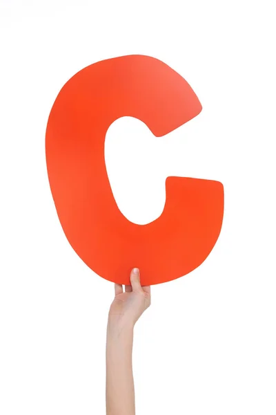 Alphabet letter in child hand — Stock Photo