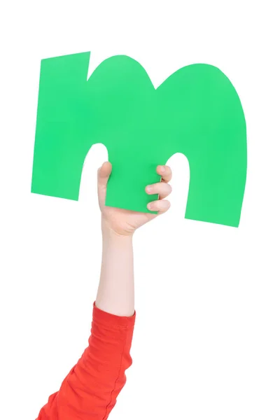 Alphabet letter in child hand — Stock Photo