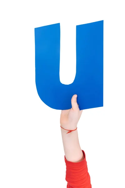 Alphabet letter in child hand — Stock Photo