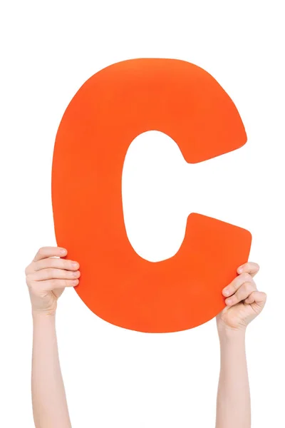 Alphabet letter in children hands — Stock Photo