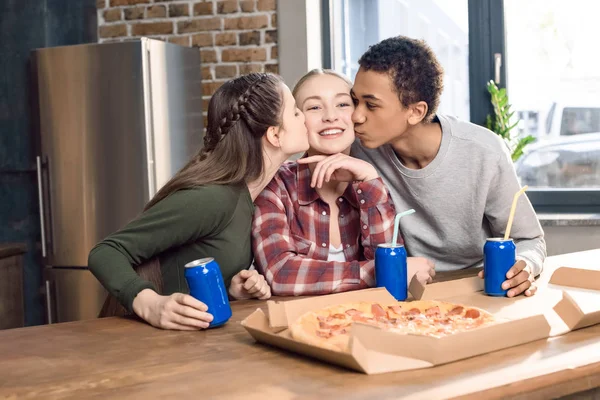 Friends kissing girl — Stock Photo