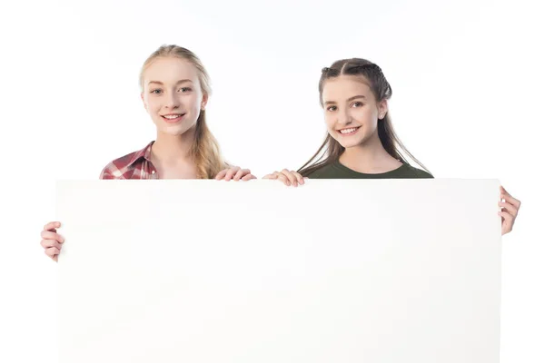 Teenage girls with banner — Stock Photo