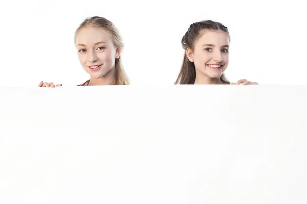 Teenage girls with banner — Stock Photo