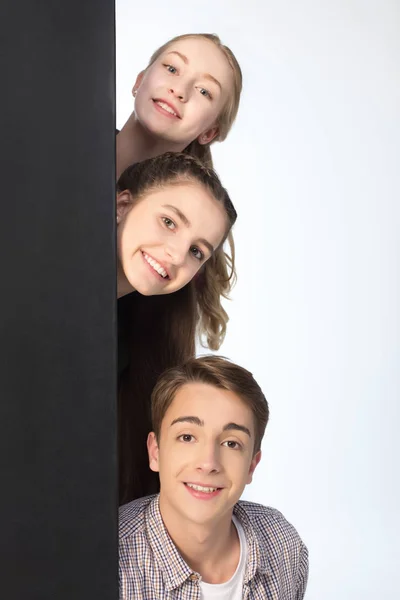 Teenagers with big banner — Stock Photo