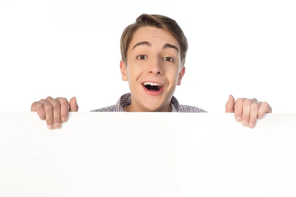 Teenage boy holding banner — Stock Photo