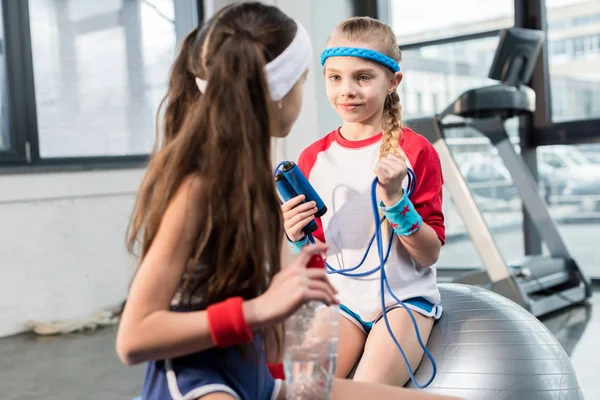 Little girls in sportswear at fitness studio — Stock Photo