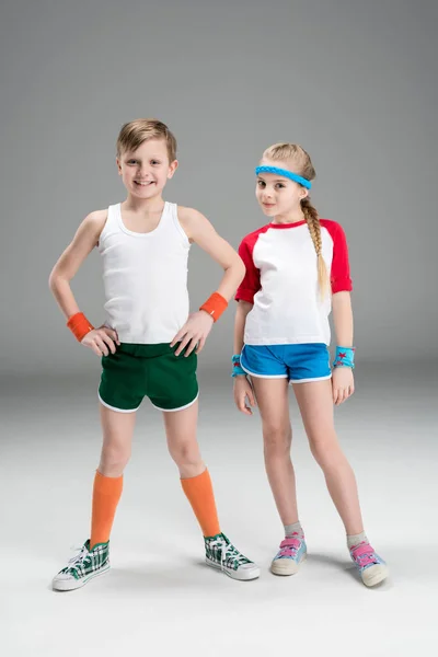 Boy and girl in sportswear — Stock Photo