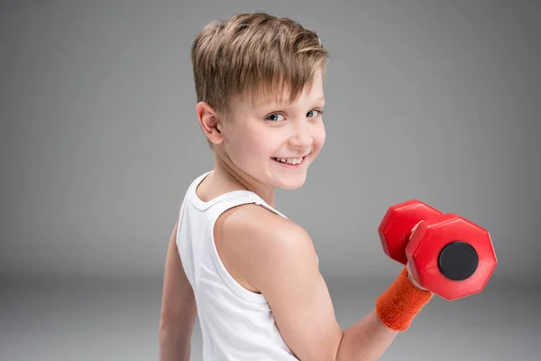 Active boy with dumbbell — Stock Photo