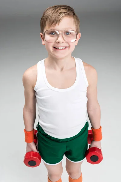 Active boy with dumbbells — Stock Photo