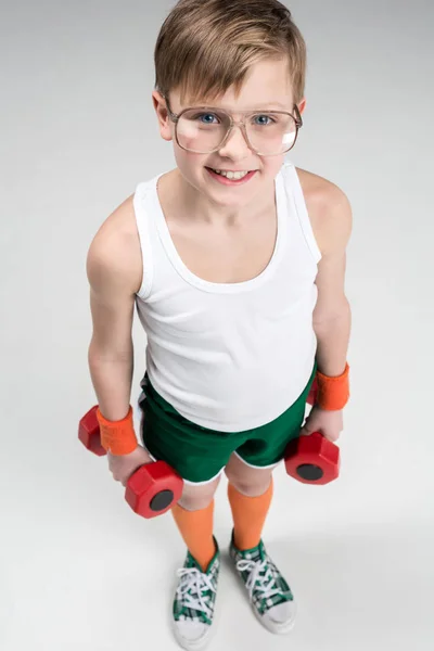 Active boy with dumbbells — Stock Photo