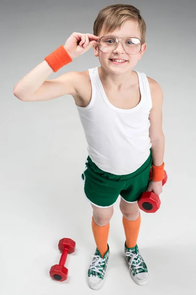 Active boy with dumbbells — Stock Photo